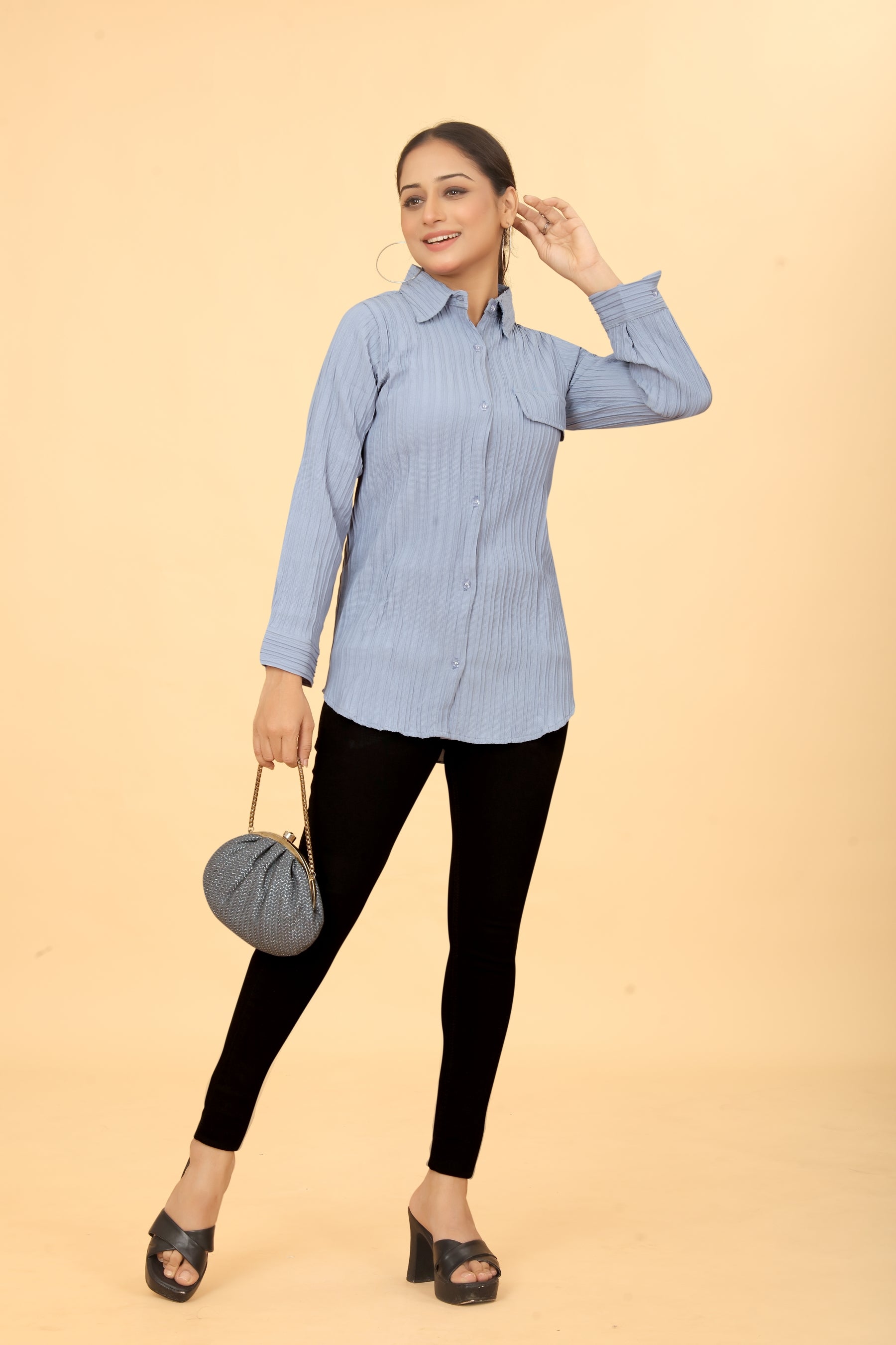 Woman wearing a sky blue button-down  neck top