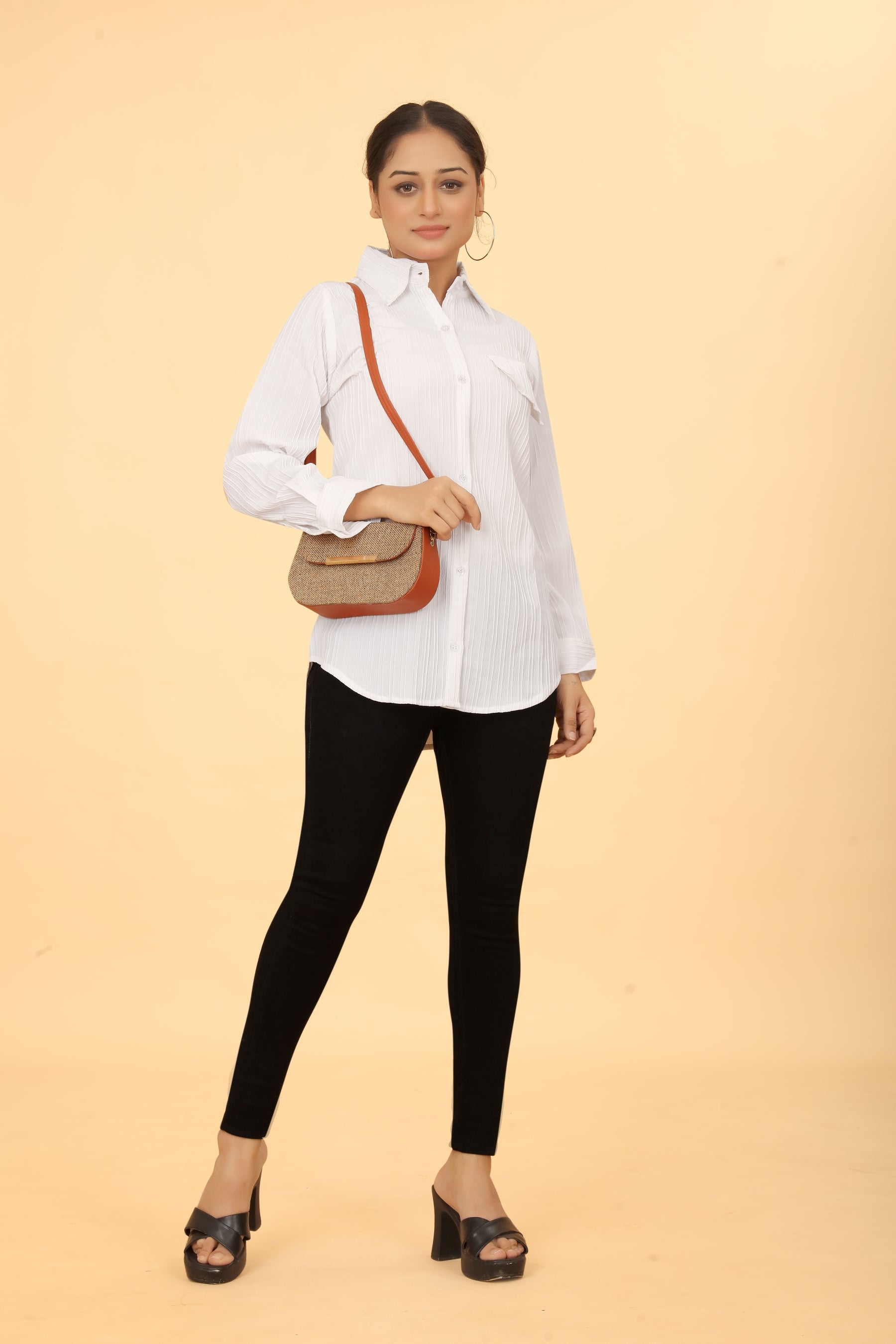 Woman wearing a white button-down collar neck top