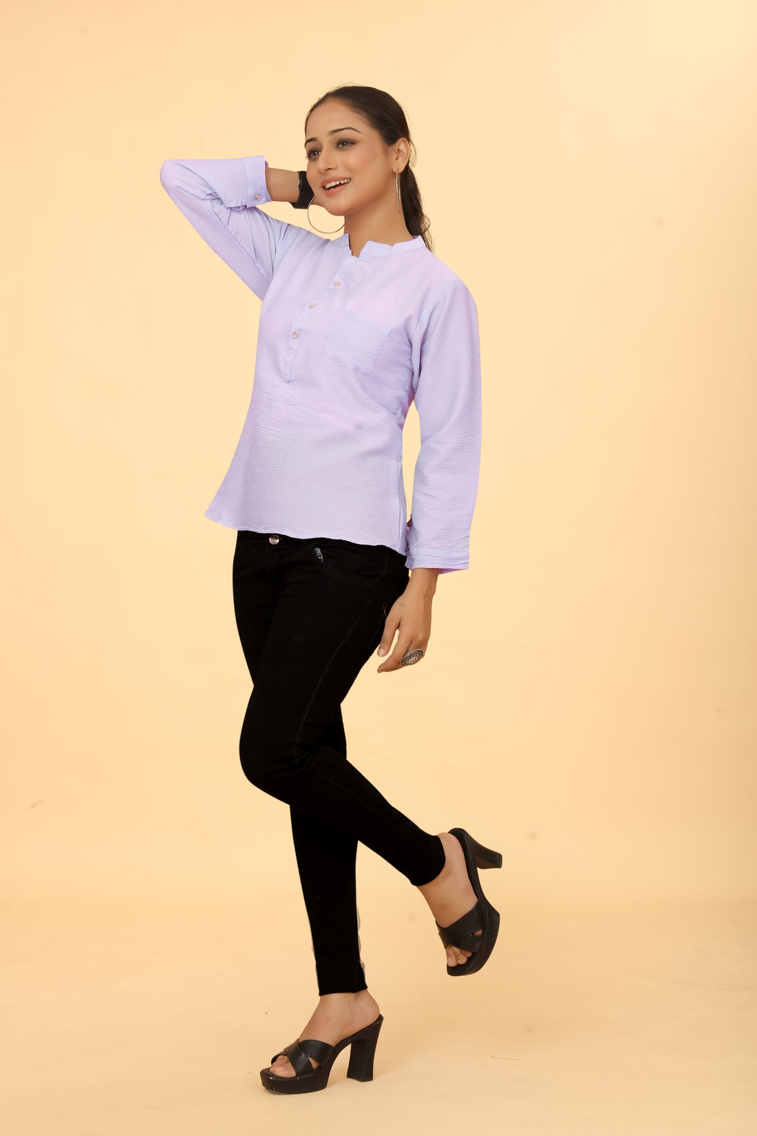 Casual Wear Tunic - A woman wearing a lavender casual wear tunic with a round neckline and short sleeves.