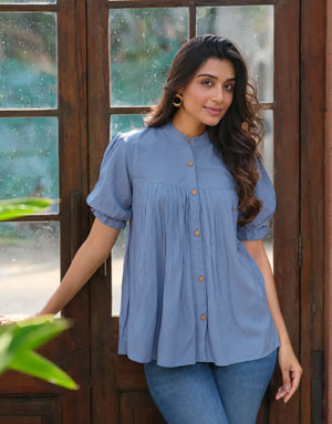 blue pleated button top
